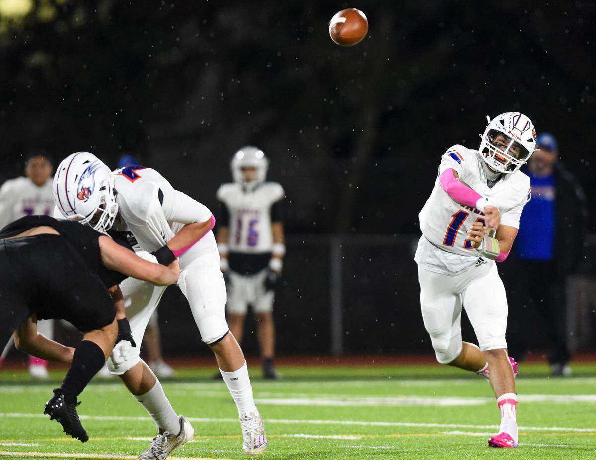 Graham-Kapowsin’s Daveon Superales (15) throws the ball during the first half of the game against Emerald Ridge at Sparks Stadium, Saturday, Oct. 21, 2023, in Puyallup, Wash.