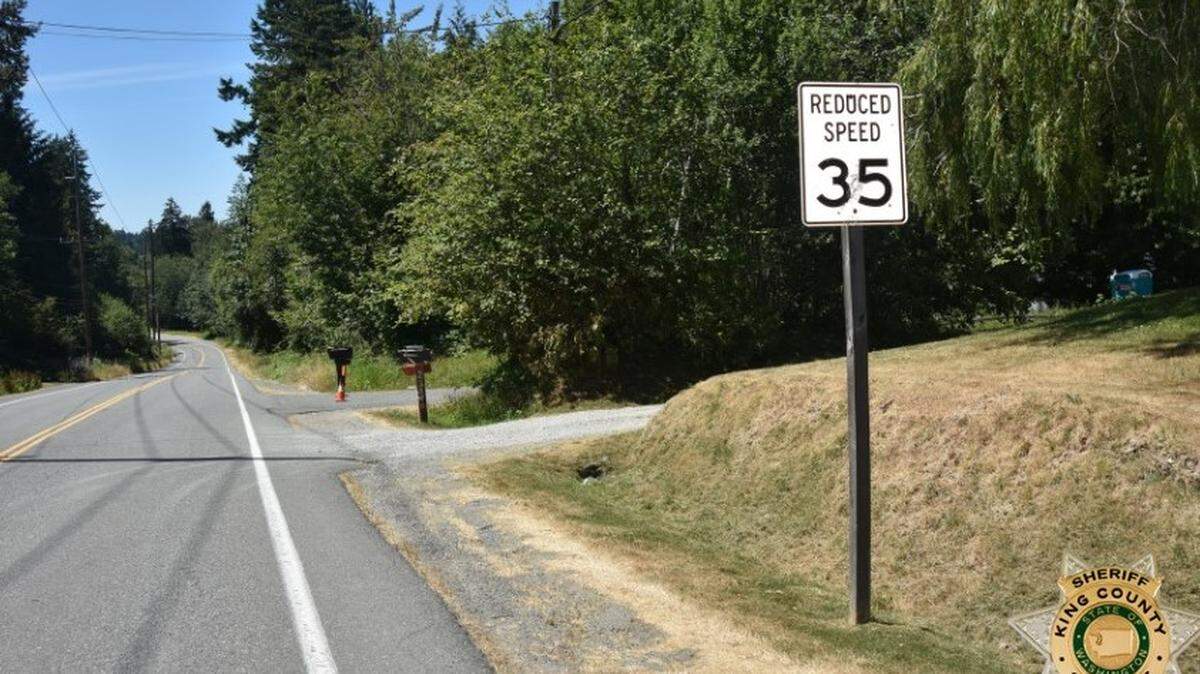 In this photo posted on July 20, 2021, deputies find a 53-year-old man’s body on the side of the road in Maple Valley, Washington. The man had been running alongside the road when a 15-year-old girl struck him and drove off, officials said.