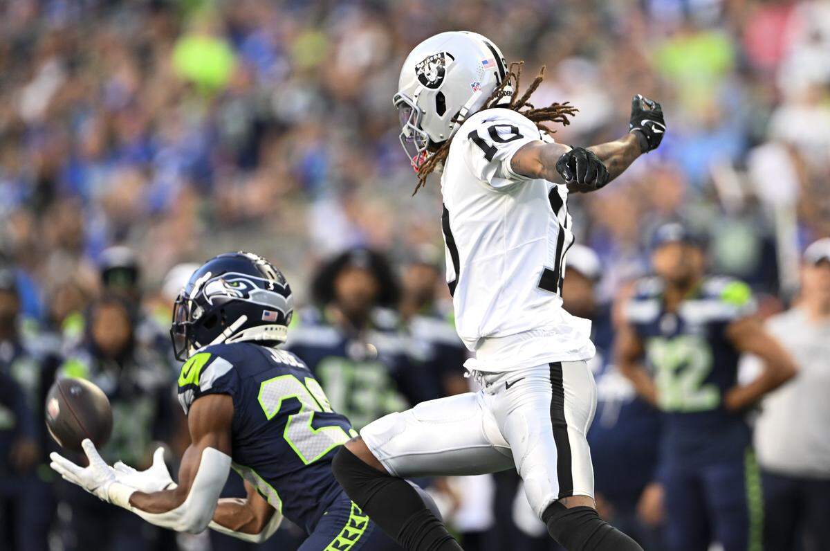 Seattle Seahawks cornerback Josh Jobe (29) picks off a pass intended for Las Vegas Raiders wide receiver Dont'e Thornton Jr. (10) during the second quarter of the game at Lumen Field, on Thursday, Aug. 7, 2025, in Seattle, Wash.