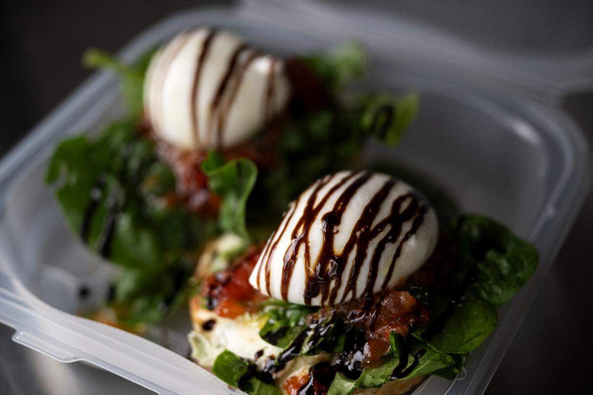 The open-faced burrata toast with pumpkin seed pesto and tomato jam is a signature item at B’s Bagels. The shop will feature the sandwich at BagelFest on its truffle-parmesan bagel.