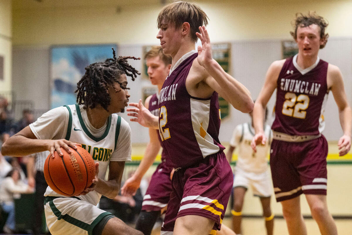 Foss guard Jamie Killian-Howard drives to the basket as Enumclaw guard Wyatt Neu defends during the third quarter of 2A SPSL game on Tuesday, Jan. 24, 2023, in Tacoma, Wash.