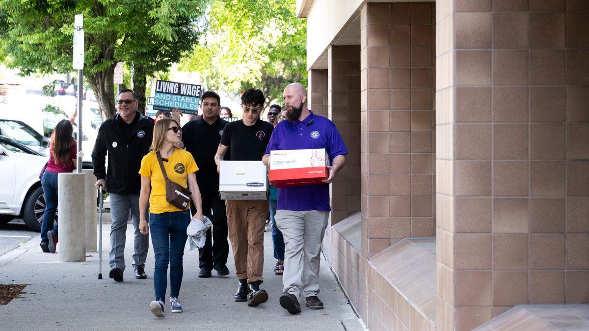 United Food & Commercial Workers Local 367 and the Tacoma chapter of the Democratic Socialists of America drop off signatures to get the Workers Bill of Rights on this November’s ballot, at Tacoma City Hall on Tuesday, June 24, 2025, in Tacoma, Wash.