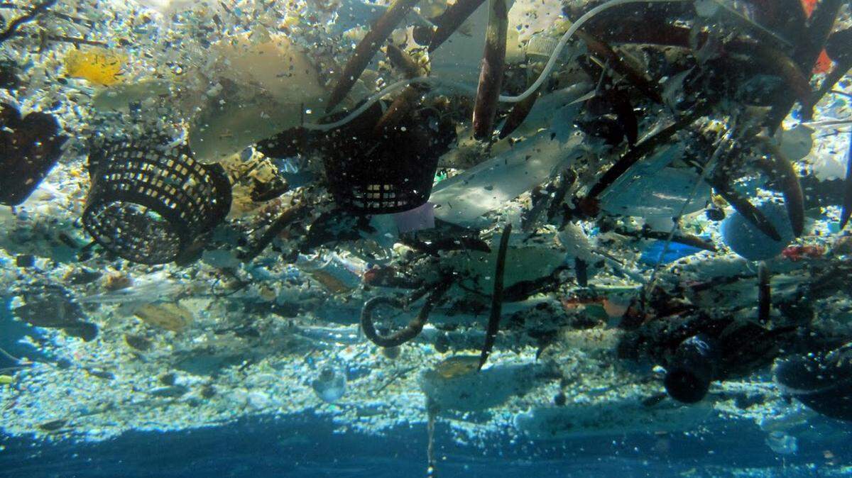 FILE - This file 2008 photo provided by NOAA Pacific Islands Fisheries Science Center shows debris in Hanauma Bay, Hawaii. A new study estimates nearly 270,000 tons of plastic is floating in the world's oceans. That's enough to fill more than 38,500 garbage trucks if each truck carries 7 tons of plastic. The figure appears in a study published Dec. 10, 2014, in the scientific journal PLOS ONE. Researchers say the plastic is broken up into more than 5 trillion pieces.