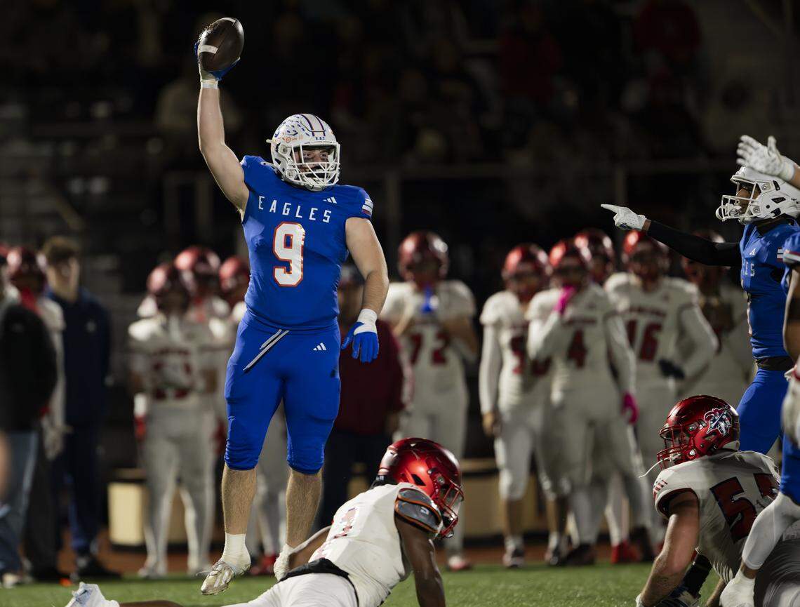 Graham Kapowsin linebacker Gavin Deaton (9) holds up the ball after recovering a Kennedy Catholic Lancers fumble during the first half of the opening round 4A state tournament game at Art Crate Field, on Saturday, Nov. 15, 2025, in Spanaway.
