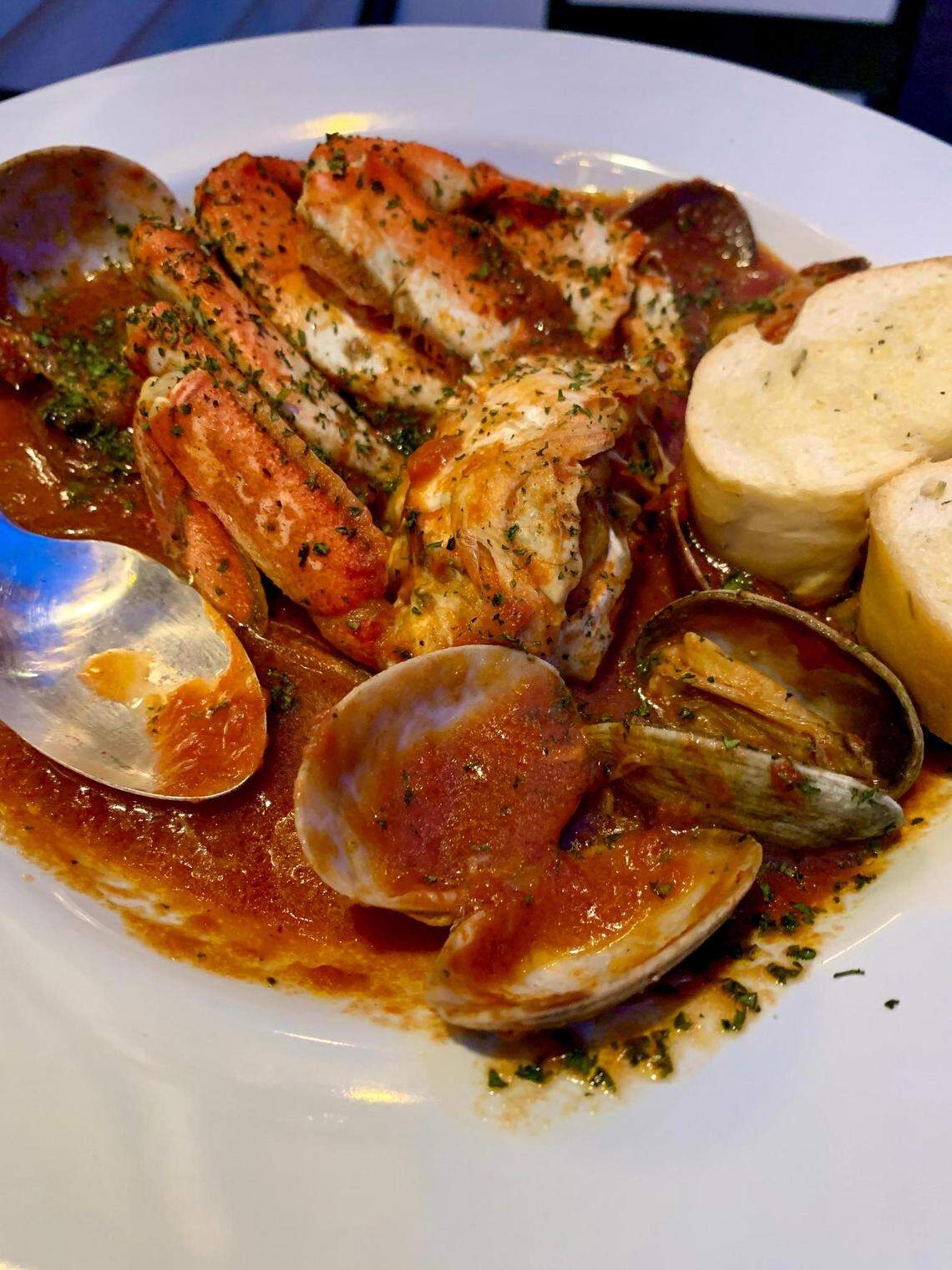 The Zuppa del NordOvest at Crudo & Cotto in the Proctor District of Tacoma, Wash., features a half Dungeness crab and clams over a rich, fish-bone tomato broth.