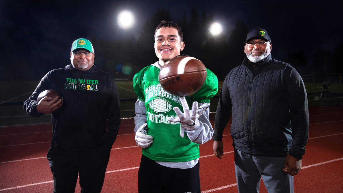 There’s a history of football state championships in the Clark family, with brothers Keith Clark (left) and Kevin Clark winning titles in 1989 and 1990 respectively. Tumwater senior running back Kooper Clark hopes to joing them with his own football state championship when the T-Birds face the Anacortes Seahawks on Saturday afternoon at the University of Washington stadium in Seattle. The trio were photographed at Tumwater District Stadium in Tumwater, Washington, on Wednesday, Nov. 29, 2023.