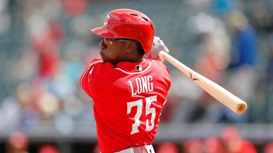 Cincinnati Reds’ Shed Long bats during the first inning of a spring training baseball game against the Kansas City Royals, Wednesday, Feb. 28, 2018, in Surprise, Ariz. (AP Photo/Charlie Neibergall)