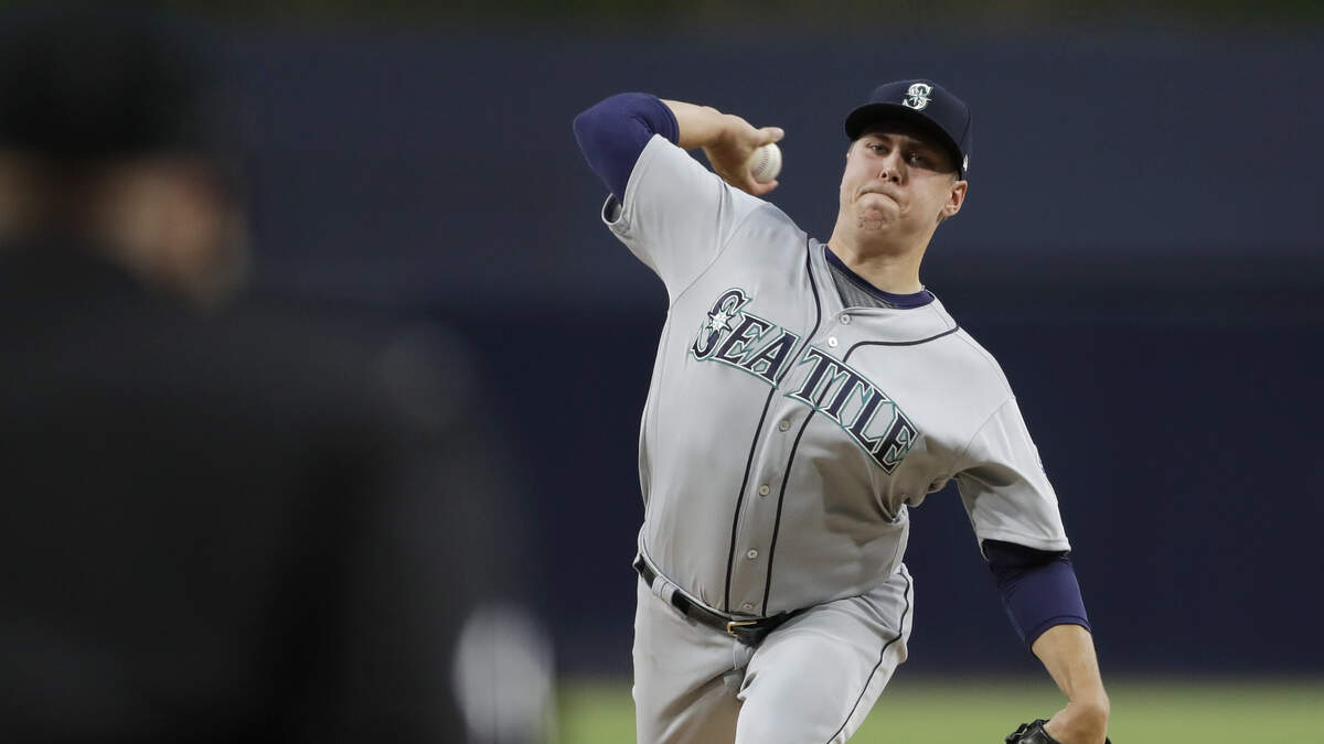 Seattle Mariners starting pitcher Erik Swanson works against a San Diego Padres batter during the first inning of a baseball game Tuesday, April 23, 2019, in San Diego.
