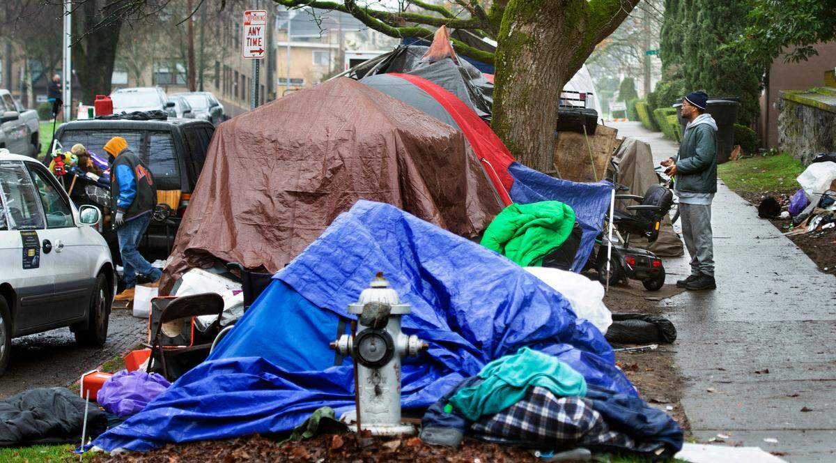 Safety concerns around a growing homeless encampment at Seventh Street and Tacoma Avenue, shown on Tuesday, Dec. 7, 2021, have prompted the owners of the nearby Cider & Cedar Taproom to move to new location in downtown Tacoma, Washington.