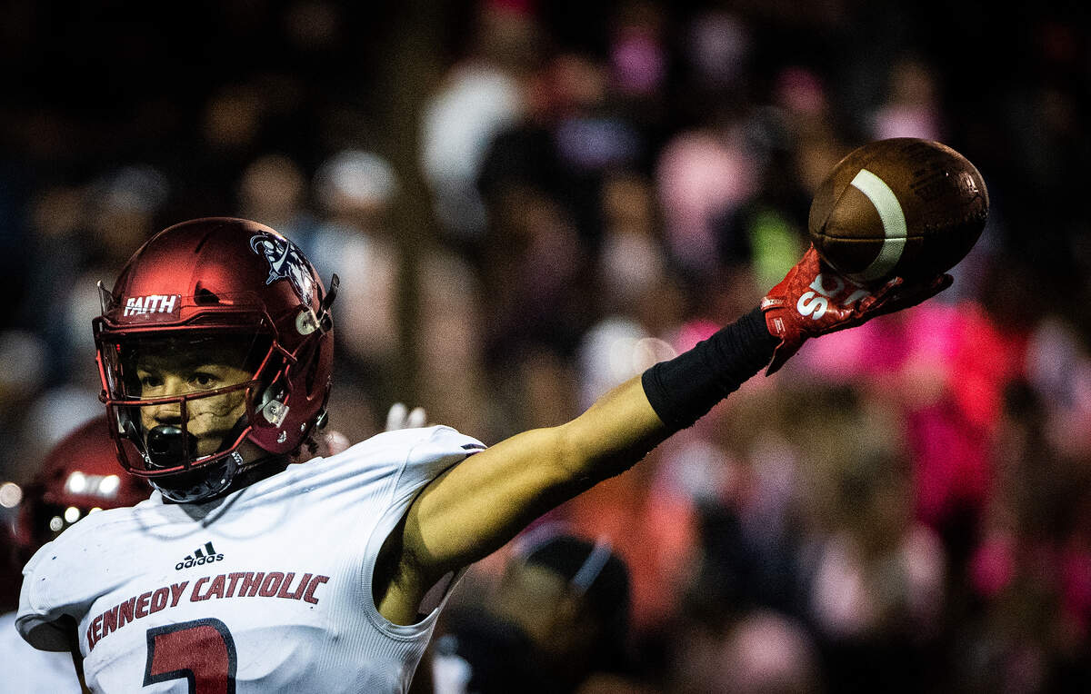 Kennedy Catholic’s Junior Alexander holds up a recovered fumble. Kennedy Catholic played Enumclaw in a football game at the Enumclaw Expo Center in Enumclaw, Wash., on Friday, Oct. 4, 2019.