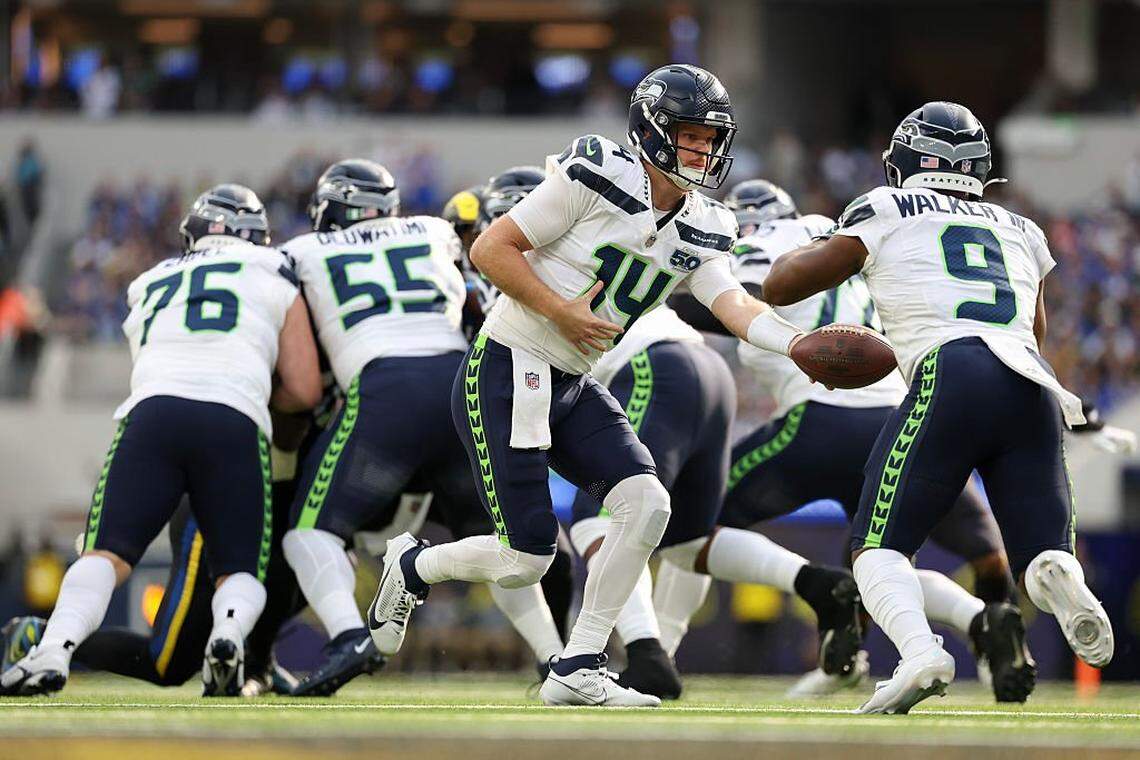 Seattle Seahawks quarterback Sam Darnold (14) hands the ball to teammate Kenneth Walker III (9) during the first quarter at SoFi Stadium on November 16, 2025 in Inglewood, California. (Photo by Sean M. Haffey/Getty Images)