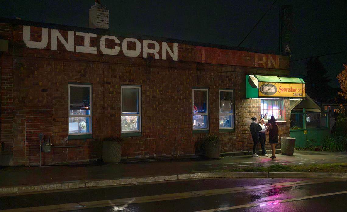 Patrons outside the Unicorn Sports Bar & Grill in Ruston, Washington, Friday, Oct. 25, 2024.