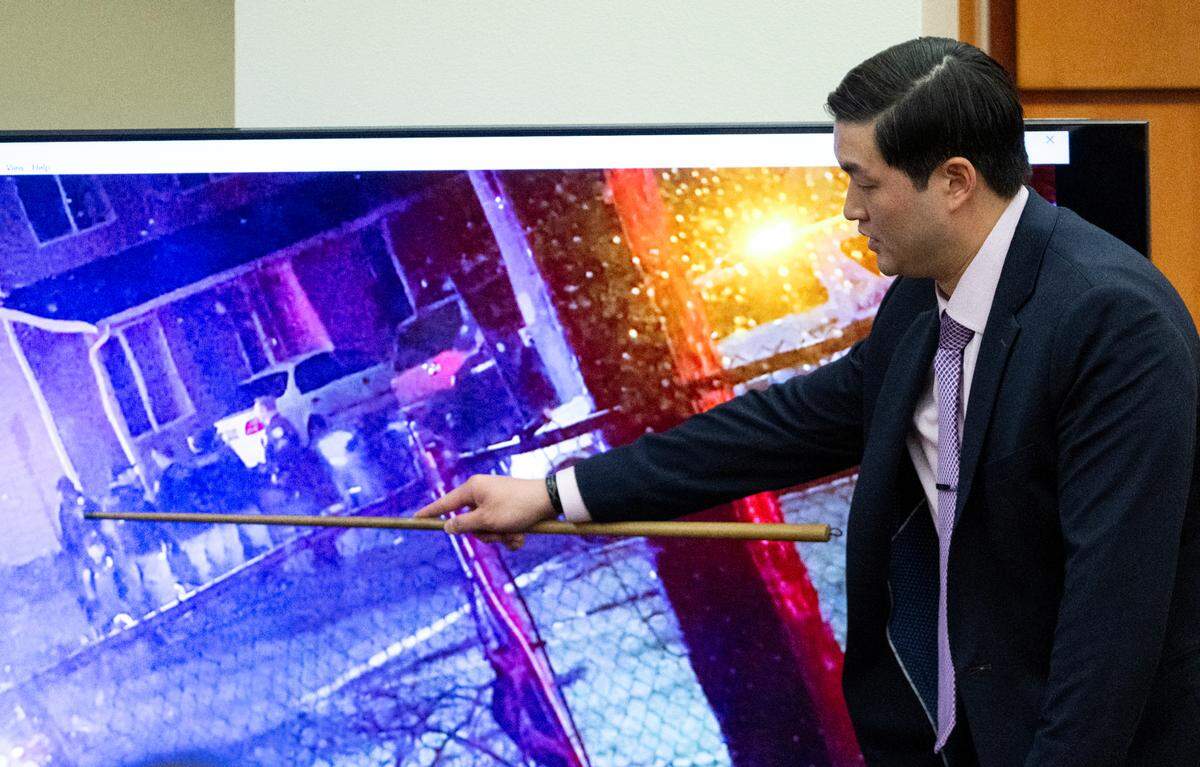 Defendant Timothy Rankine points to where he was located in a video during the trial of three Tacoma police officers in the killing of Manny Ellis.