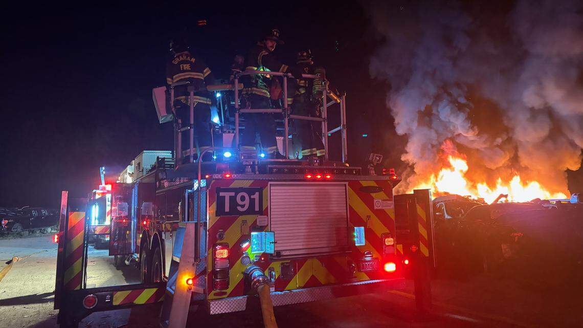 Firefighters battle flames, explosions at Pierce County auto wrecking yard