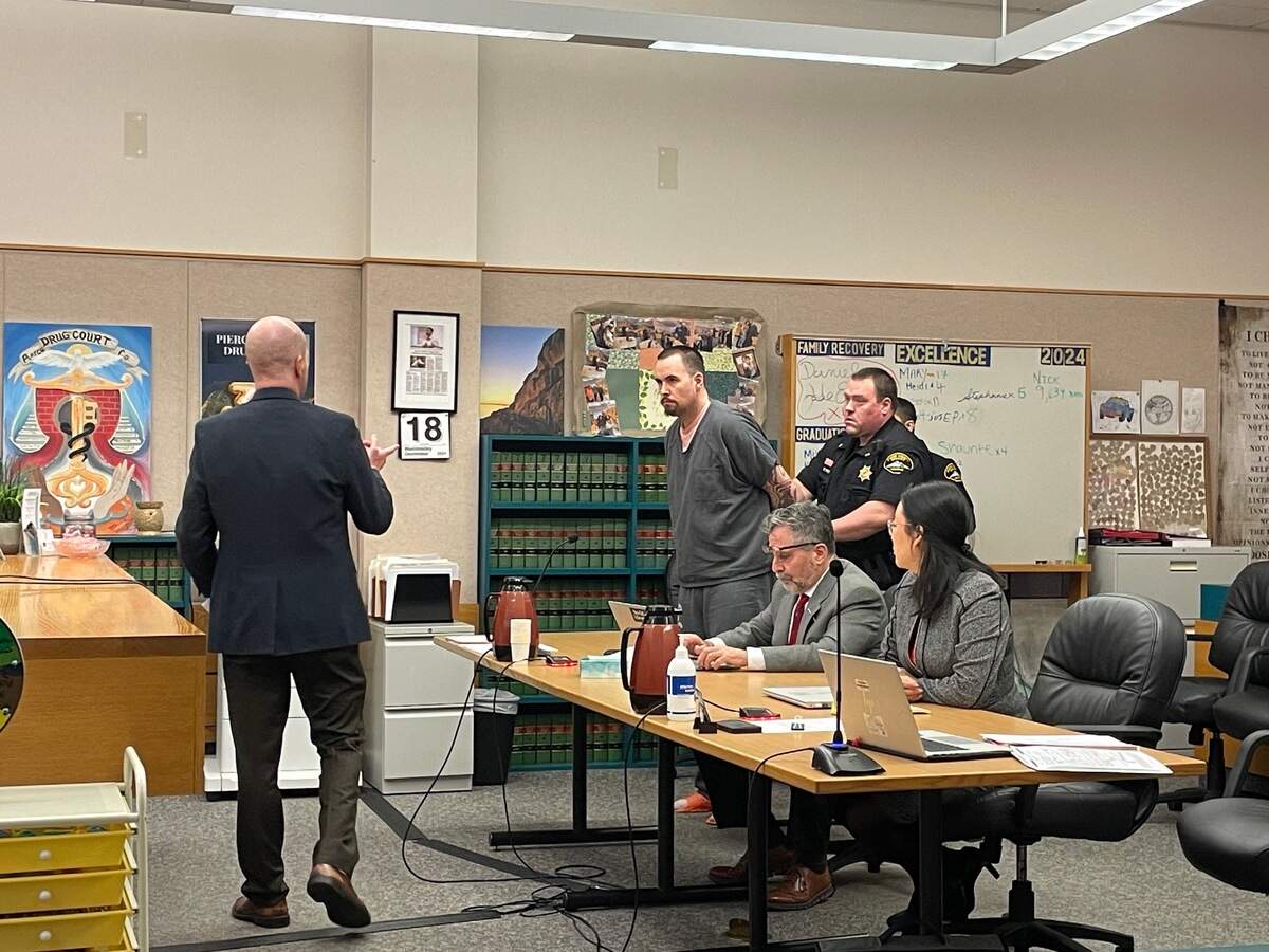 Dylan Thomas Robinson, 33, (center) is handcuffed after Pierce County Superior Court Judge Gretchen Leanderson sentenced him to five years to life in prison on Wednesday, Dec. 18, 2024 for breaking into dorms at Pacific Lutheran University last year and groping two students.