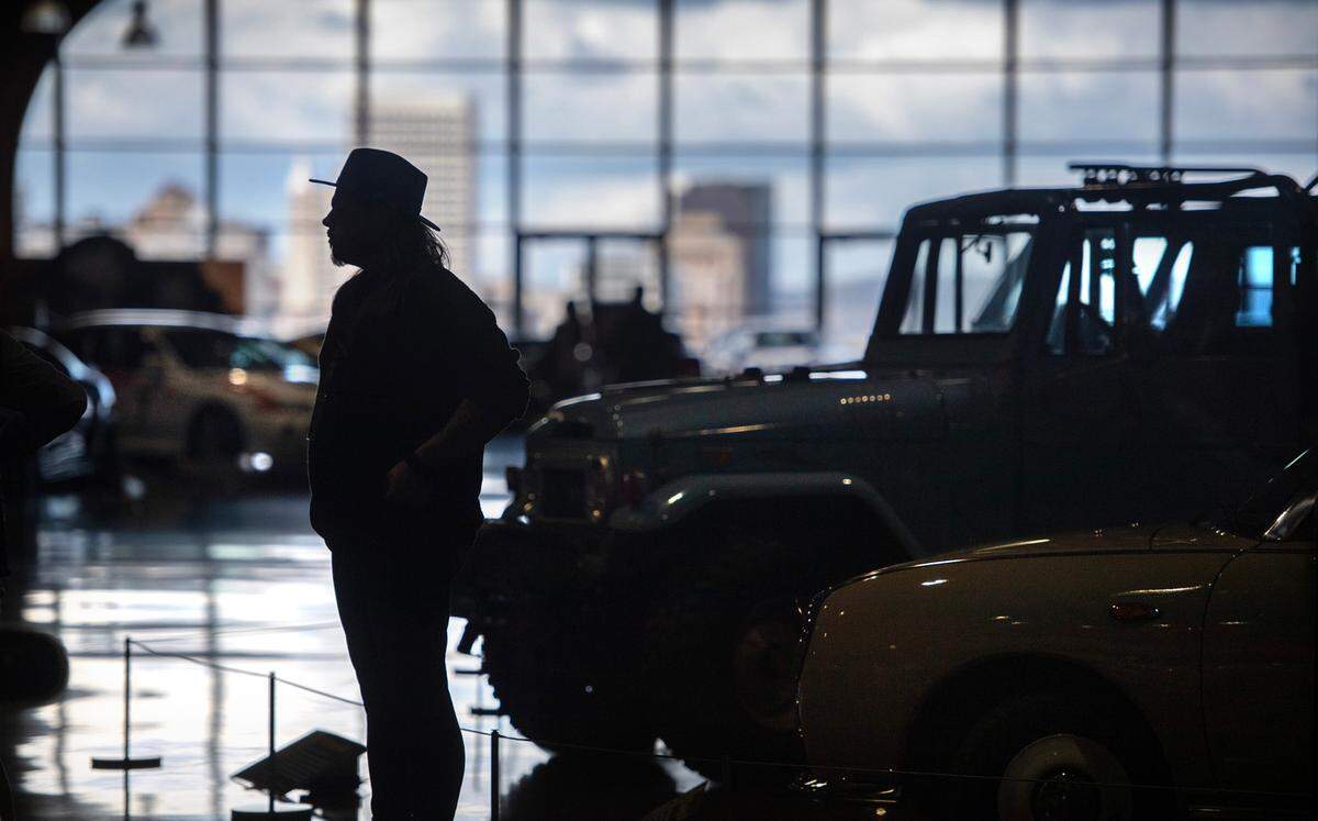 Marketing manager Jake Welk takes in the view inside the Shinka Japanese automobile exhibit at the LeMay - America’s Car Museum in Tacoma, Washington, on Tuesday, March 26, 2024.