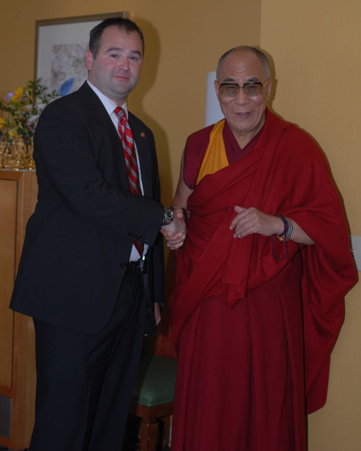 Clifton Funkhouser shakes hands with the Dalai Lama in 2011.
