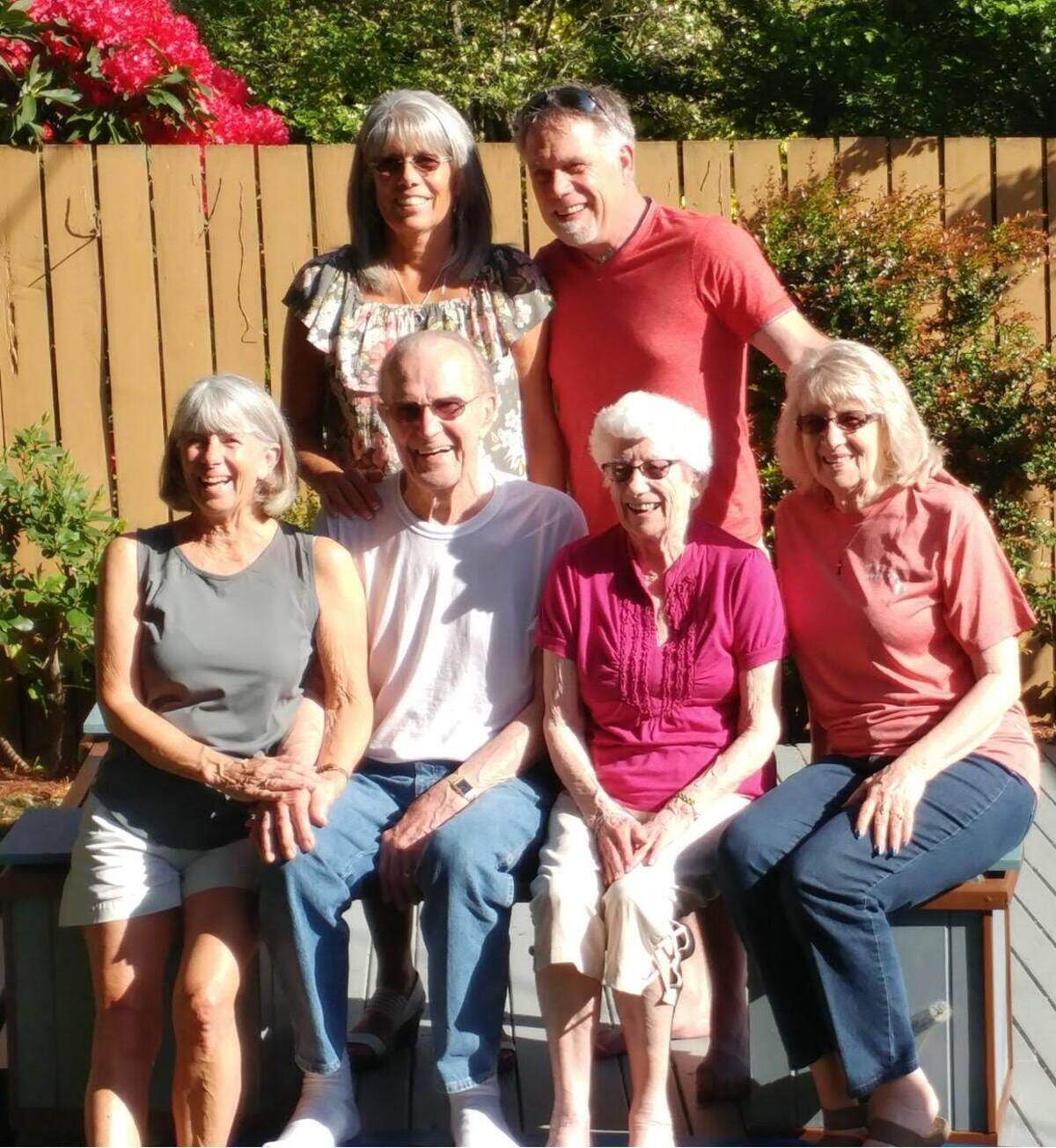 The Asplund Family sits together for a family portrait featuring four generations. Front row left to right: Linda Ireland, Eric Asplund, Betty Asplund, Sandie Myers. Back row standing left to right: Tina McGovern, Ken Asplund.