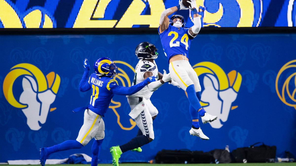 Los Angeles Rams free safety Taylor Rapp (24) intercepts a pass intended to Seattle Seahawks wide receiver DK Metcalf (14) Dec. 21, 2021. Rapp has cleared concussion protocol and could play for the Rams Sunday in Super Bowl LVI.