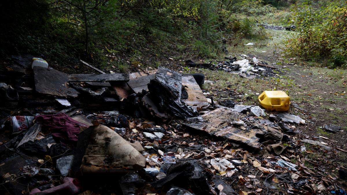 In this October file photo, debris from an encampment liters a section of forest behind the Metro Parks office that is being cleared by volunteers to turn into a disc golf course in Tacoma.