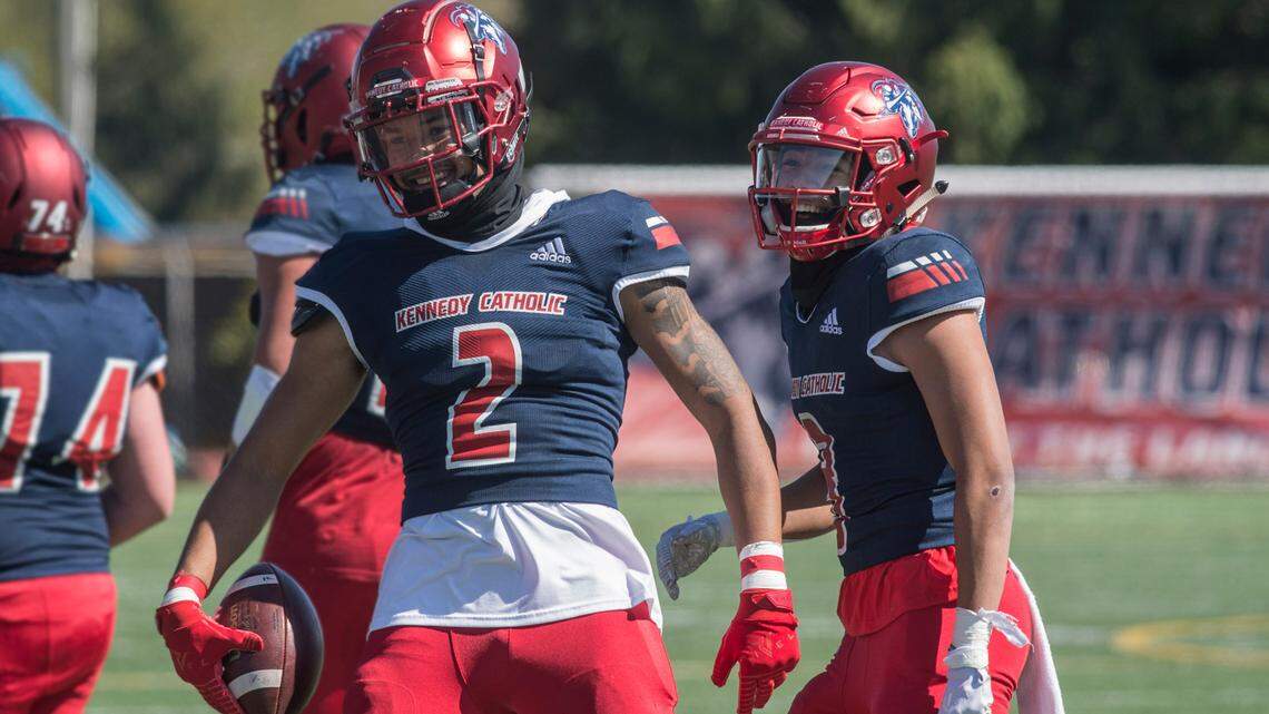 Kennedy Catholic High School receivers Junior Alexander (2) and Reed Shumpert (3) celebrate a two-point conversion during a game against Mount Rainier on Saturday, April 17, 2021 at Highline Memorial Stadium in Burien, Wash.