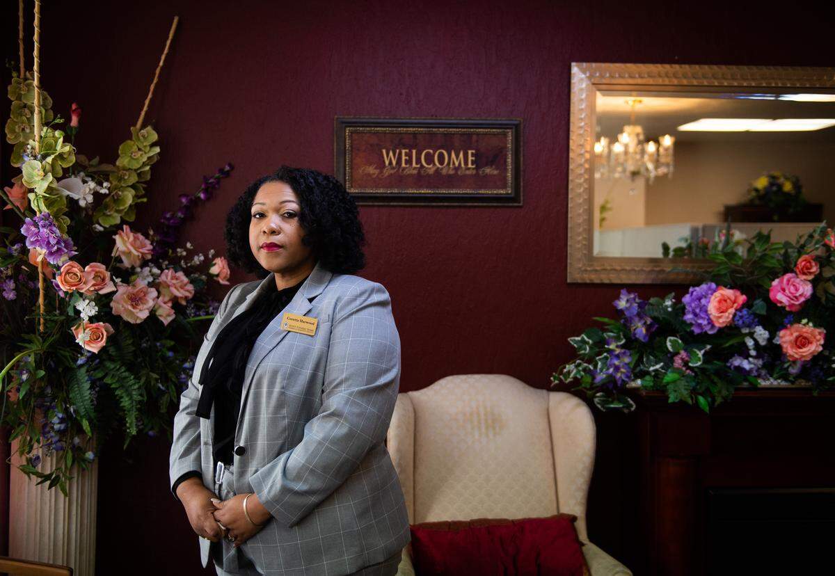 Coretta Harwood, the owner and funeral director of Scott Funeral Home, stands for a portrait at Scott's Funeral Home in Tacoma, Wash., on Tuesday, March 24, 2020. 
