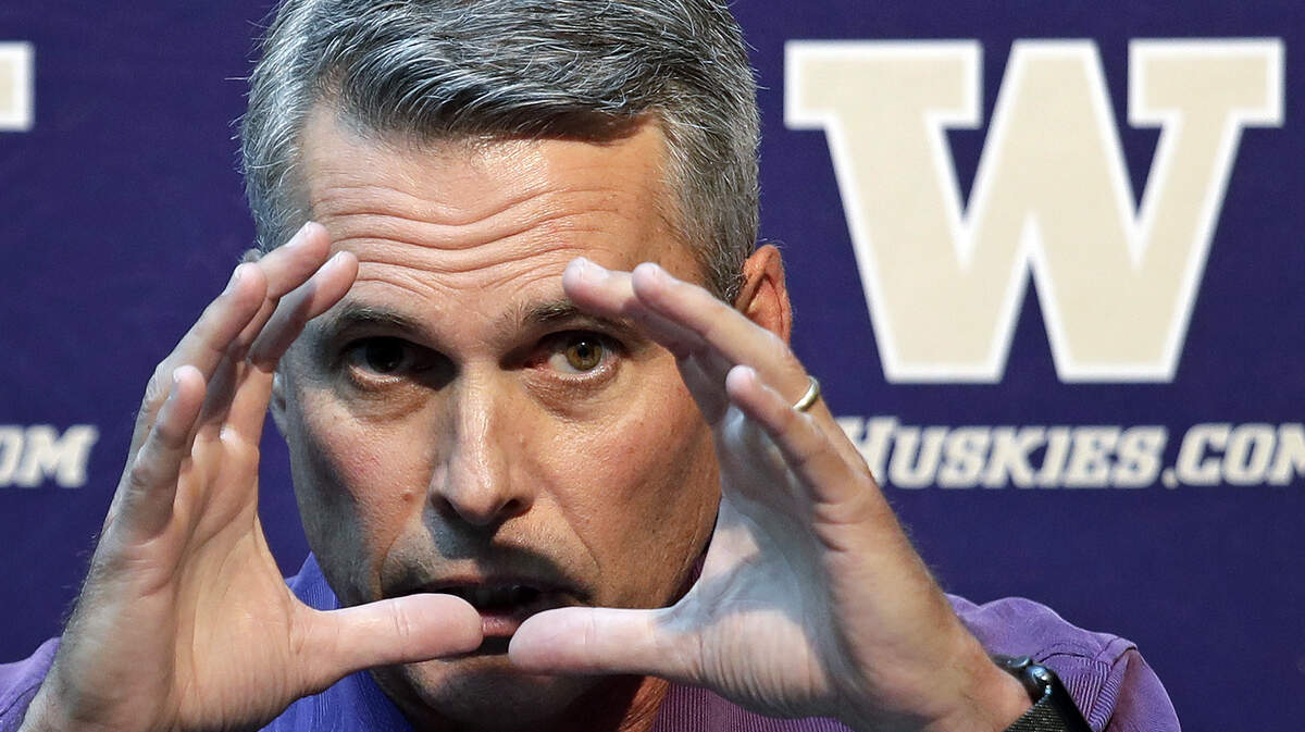 Washington head football coach Chris Petersen motions as he speaks at a news conference Thursday, Aug. 2, 2018, in Seattle. Petersen hates expectations, so he’s likely loathing Washington being the overwhelming favorite in the Pac-12 and likely top 10 when the preseason AP poll comes out. The Huskies open fall camp on Friday in preparation for the Sept. 1 opener against Auburn. (AP Photo/Elaine Thompson)