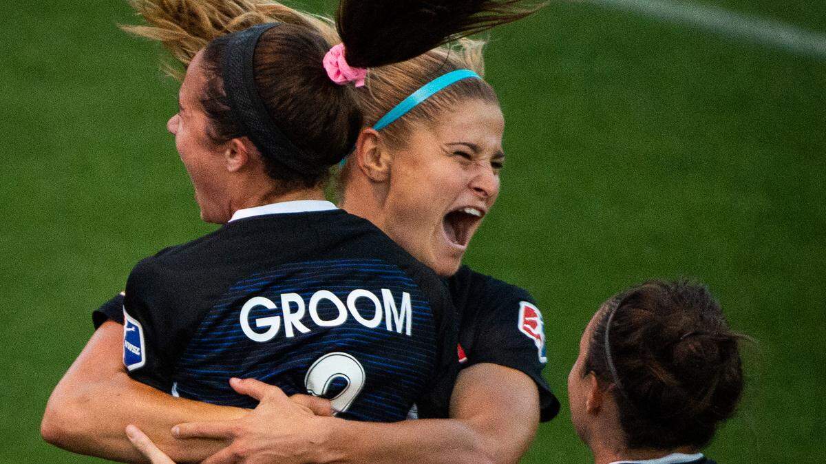 Reign FC’s Shea Groom, Jodie Taylor, and Rosie White celebrate White’s goal in the second half. Reign FC played the Portland Thorns in a National Women’s Soccer League match at Cheney Stadium in Tacoma, Wash., on Wednesday, Aug. 7, 2019.