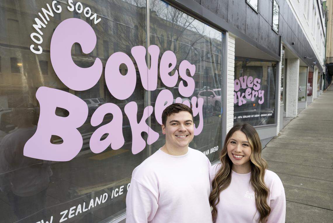 Jaxon Marquardt and Adriana Shaffer, co-owners of Cove's Bakery, stand outside their future shop on Monday, Feb. 23, 2026, in downtown Tacoma, Wash.