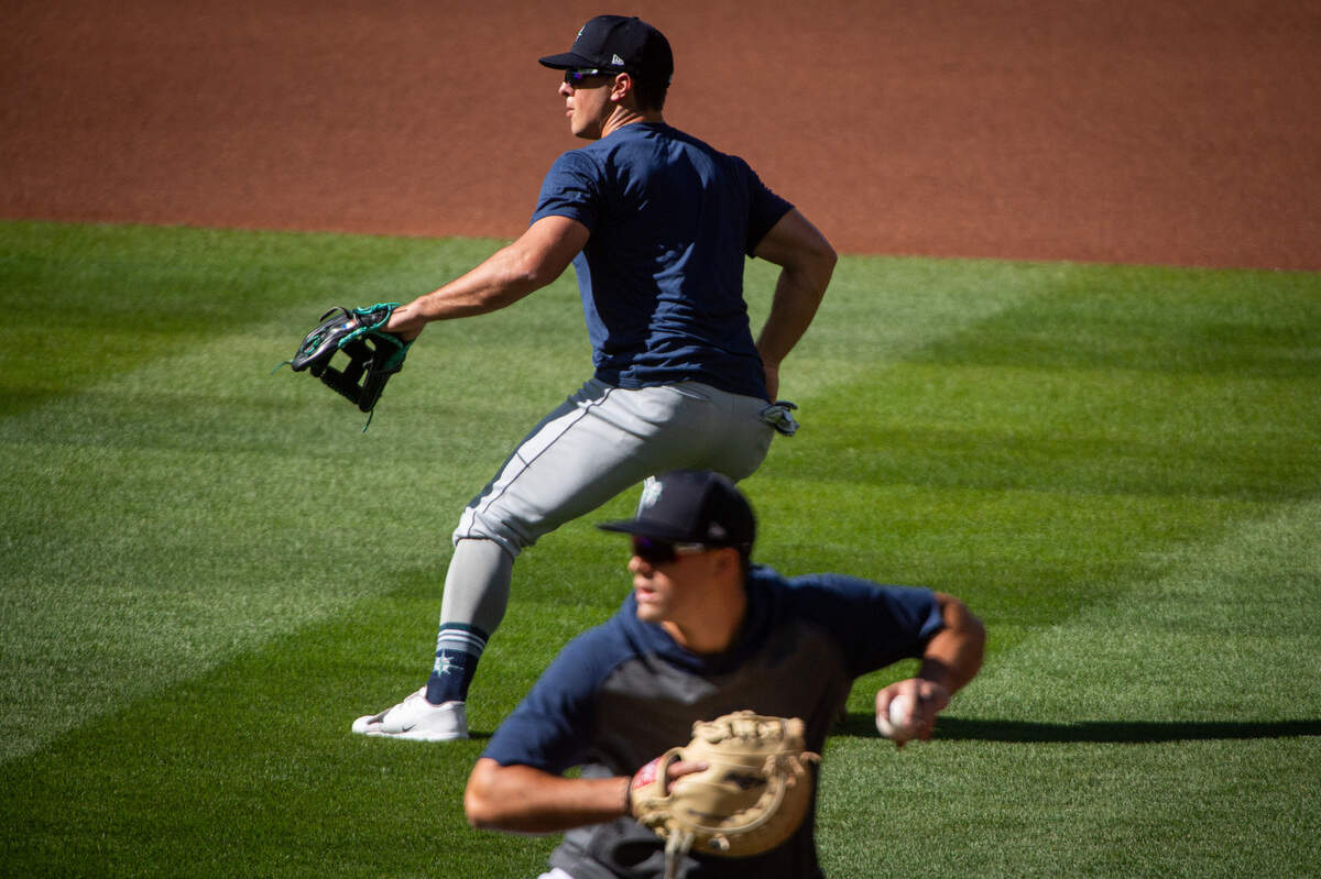 Seattle Mariners shortstop Dylan Moore (25) warms up before the Seattle Mariners intrasquad game at T-Mobile Park in Seattle, Wash., on Saturday, July 18, 2020.