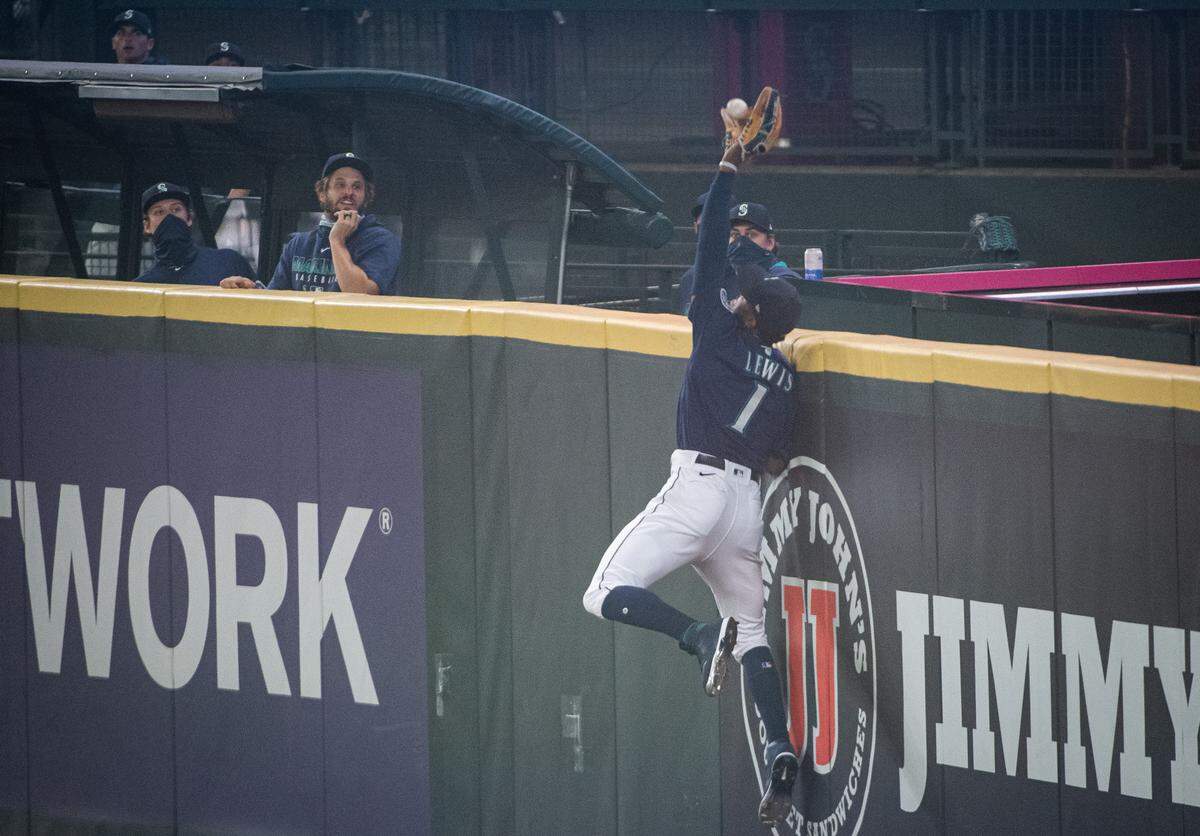 Seattle Mariners right fielder Kyle Lewis (1) robs a grand slam from Oakland Athletics right fielder Ramon Laureano (22) during the first inning. The Seattle Mariners played the Oakland Athletics in the second game of a Major League Baseball doubleheader at T-Mobile Park in Seattle, Wash., on Monday, Sept. 14, 2020.