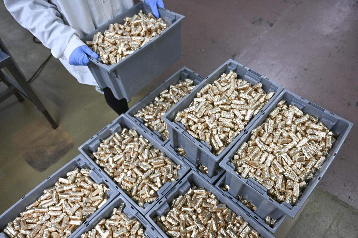 Freshly made and wrapped Almond Roca are stacked in bins at the Brown & Haley factory on Tuesday, April 7, 2026, in Tacoma, Wash.