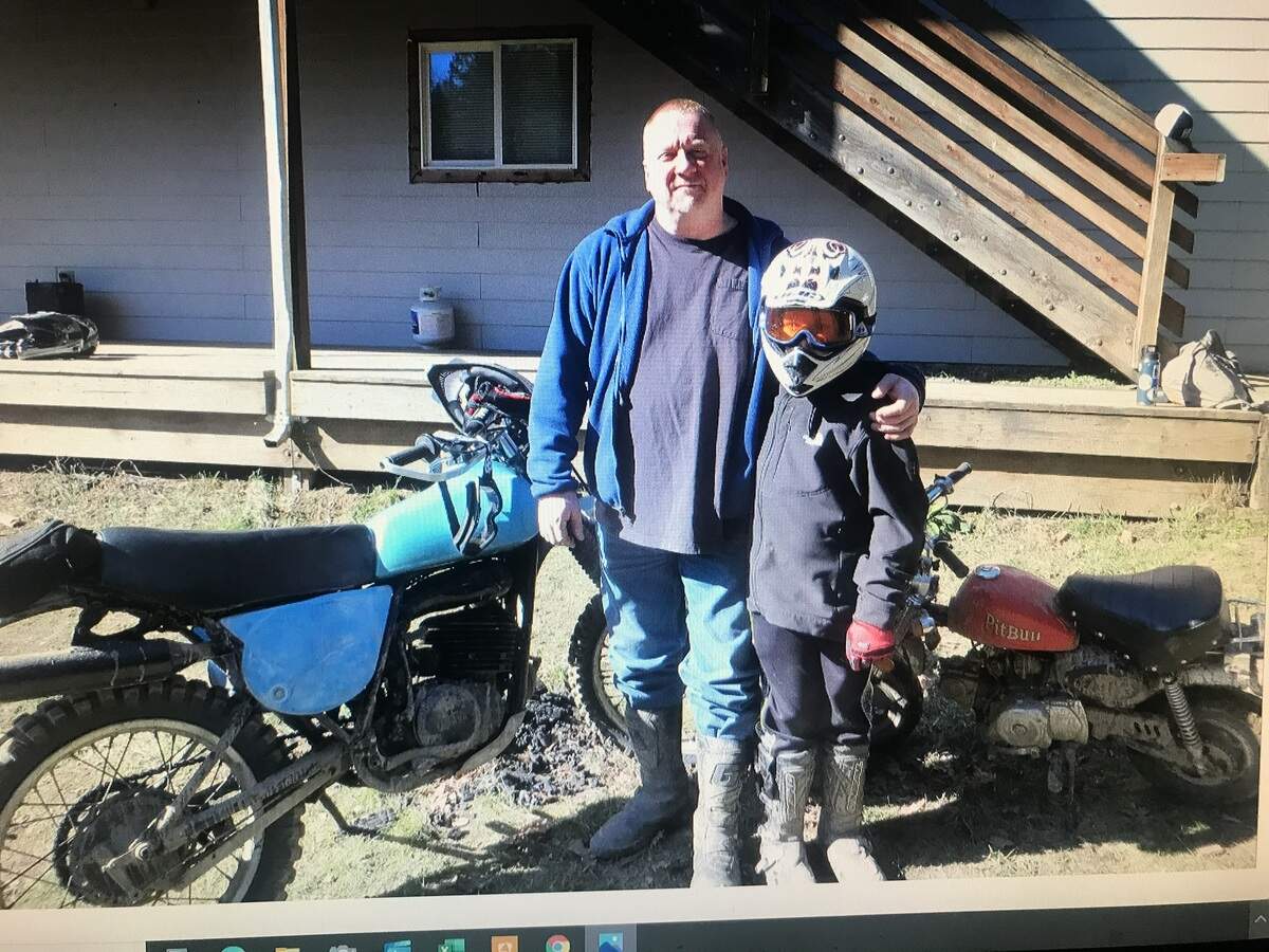Daryl Shuey poses with his son, Vaughn, in this undated photograph.