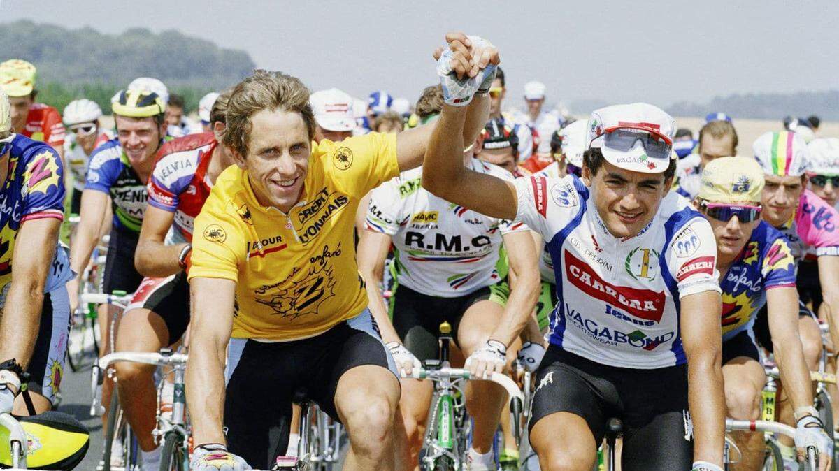 Greg LeMond, left, clasps hands with Claudio Chiappucci of Italy going into the final stage of the Tour de France in 1990. LeMond went on to win the race for the third time.