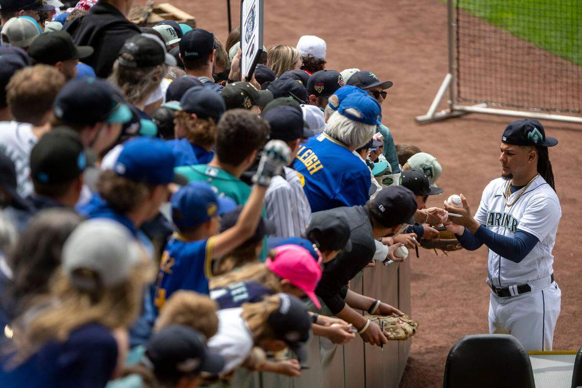 Mariners’ All-Star pitcher Luis Castillo signs autographs prior to the start of the 2023 MLB Home Run Derby on Monday, July 10, 2023, at T-Mobile Park in Seattle.