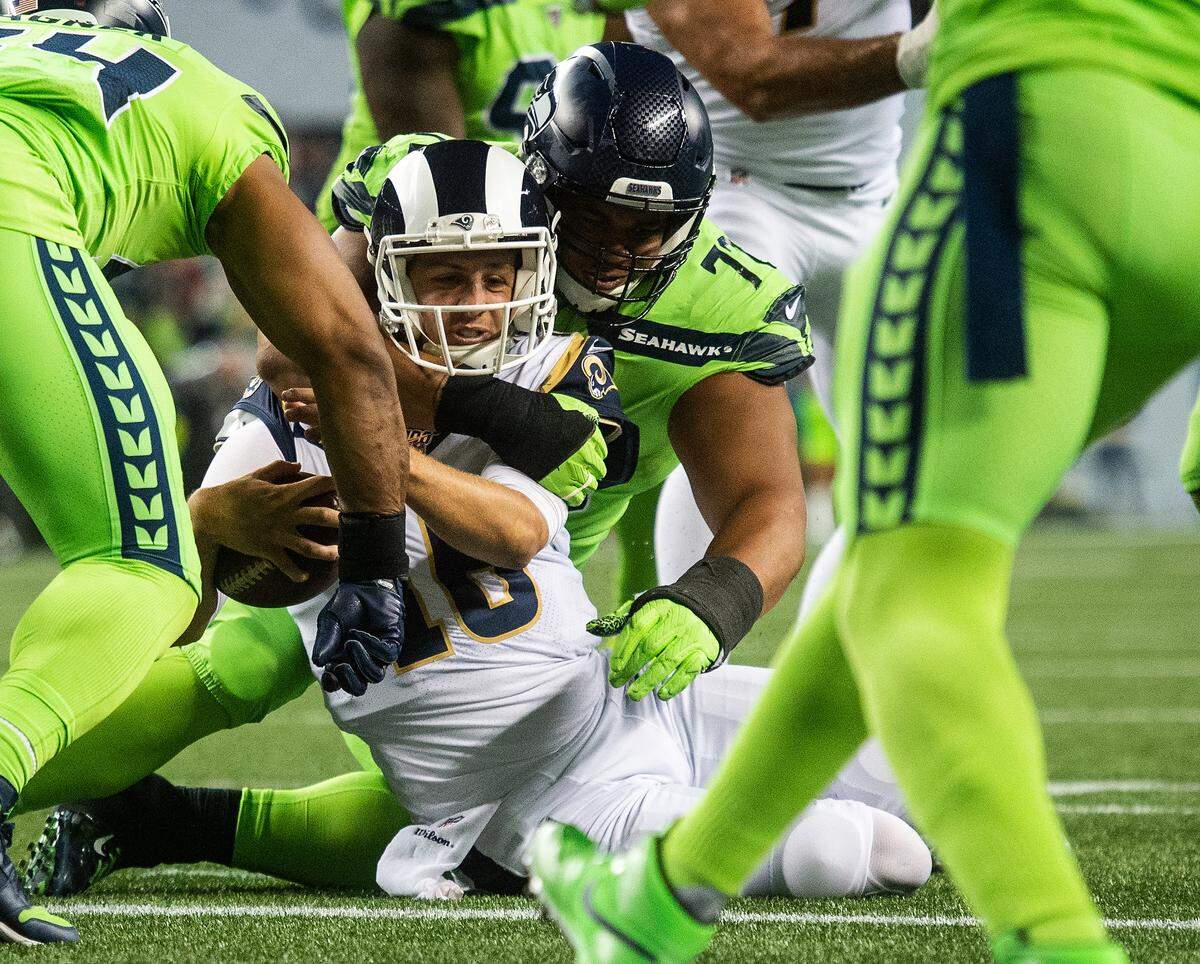 Seattle Seahawks defensive tackle Al Woods (72) stops Los Angeles Rams quarterback Jared Goff (16) short of a two-point conversion. The Seattle Seahawks played the Los Angeles Rams in a NFL football game at CenturyLink Field in Seattle, Wash., on Thursday, Oct. 3, 2019.