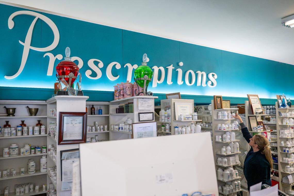 Pharmacist Liz Rankos works behind the counter of the pharmacy on Wednesday, July 9, 2025, at Rankos’ Pharmacy in the Stadium District of Tacoma, Wash.