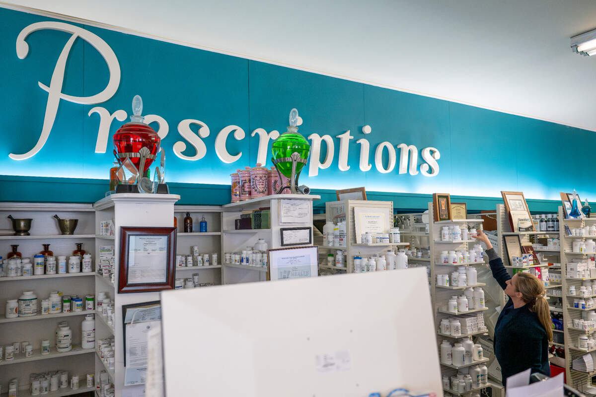 Pharmacist Liz Rankos works behind the counter of the pharmacy on Wednesday, July 9, 2025, at Rankos’ Pharmacy in the Stadium District of Tacoma, Wash.