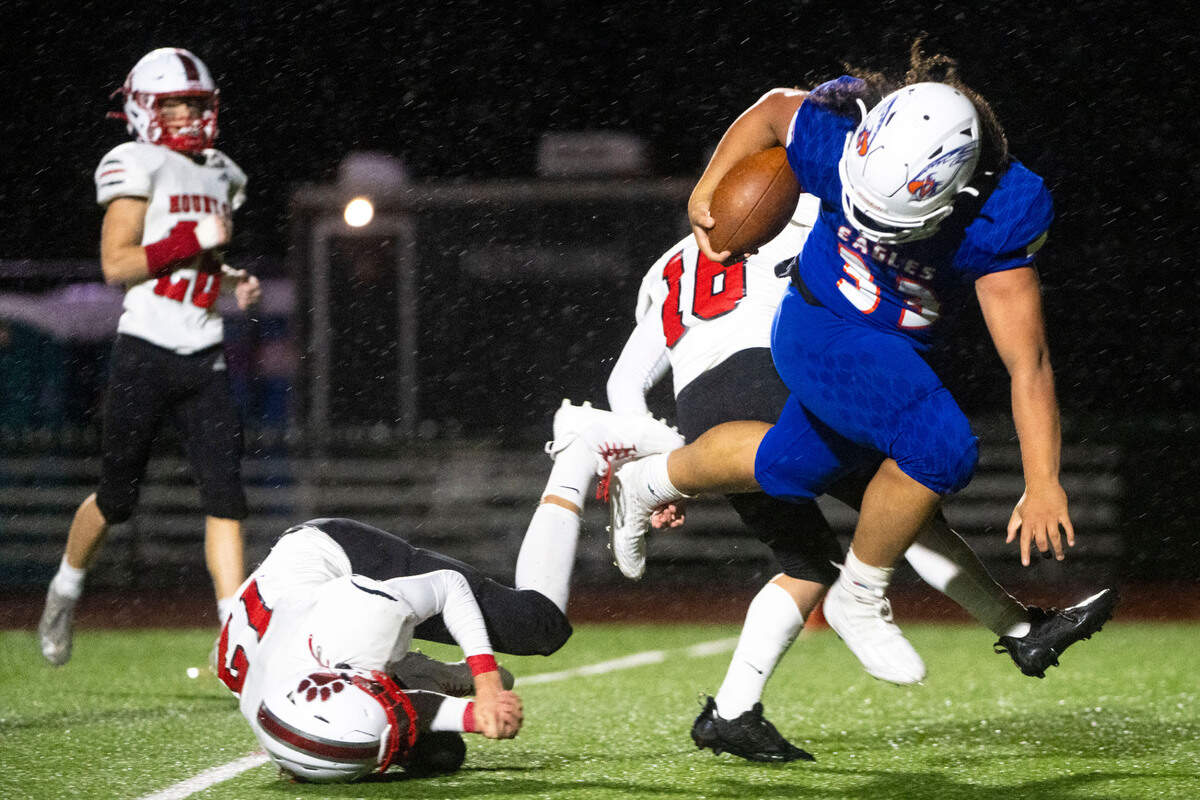 Graham-Kapowsin running back Michael Toa barrels through Mount Si’s Colby Heyting on his way into the endzone for a rushing touchdown in the fourth quarter of a Week 10 playoff game on Friday, Nov. 4, 2022, at Art Crate Field in Spanaway, Wash.