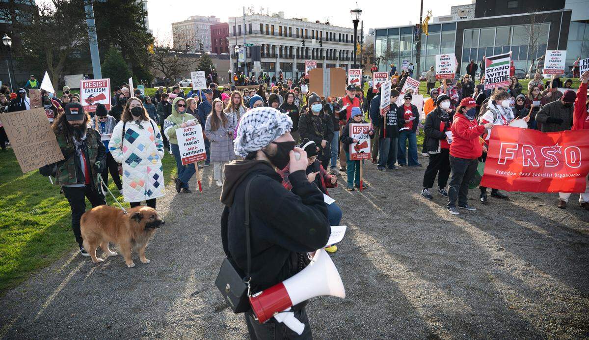 About 350 protesters gathered to oppose a variety of concerns, including the Trump agenda and the war in Gaza, during the “End the Attacks on the People!” protest rally at Fireman’s Park in downtown Tacoma, Washington, on Monday, Jan. 20, 2025.