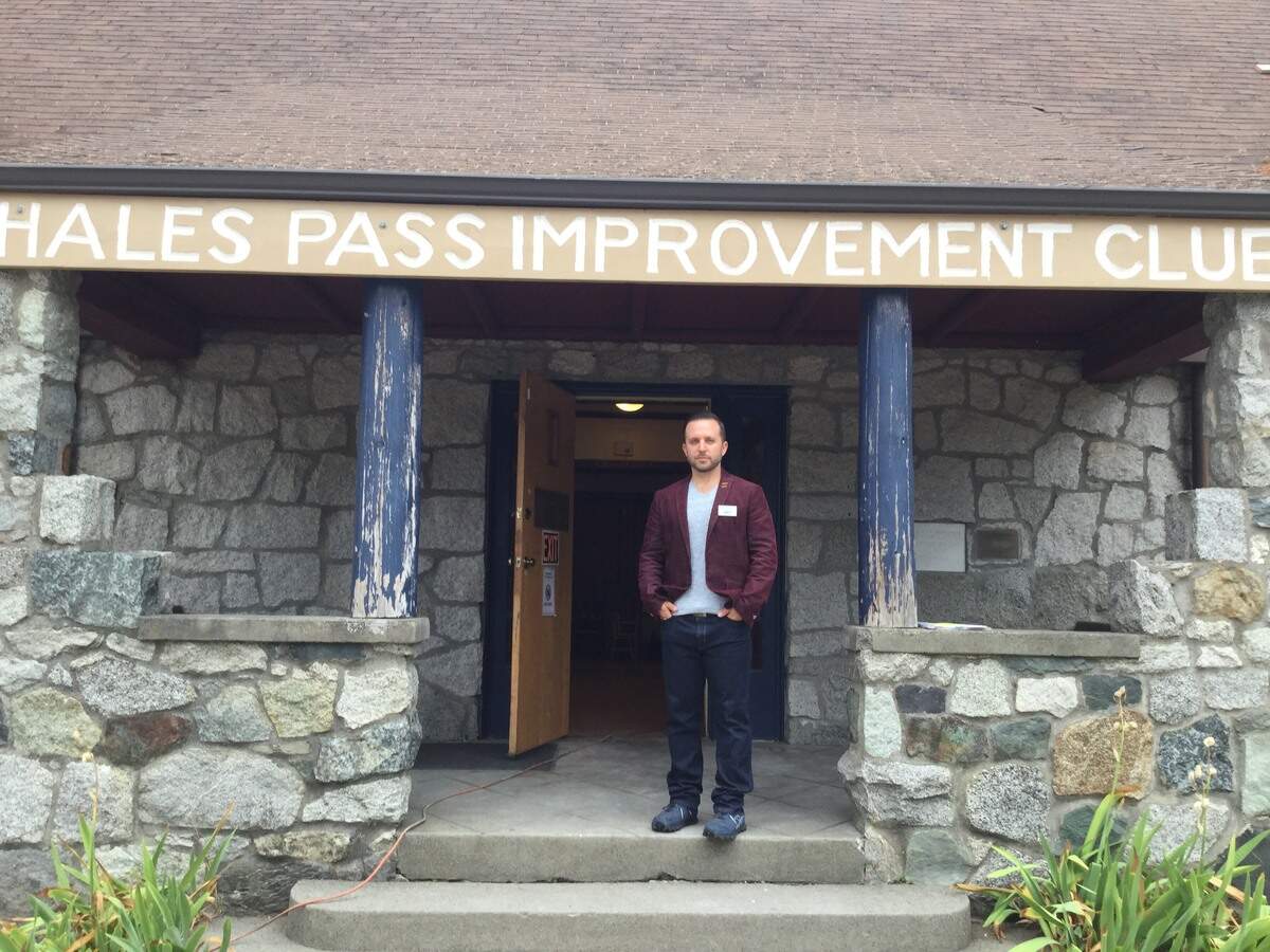 Richard Fink, Executive Director of PenMet Parks, stands in the entrance way of the historic Arletta School building at Hales Pass in Gig Harbor.