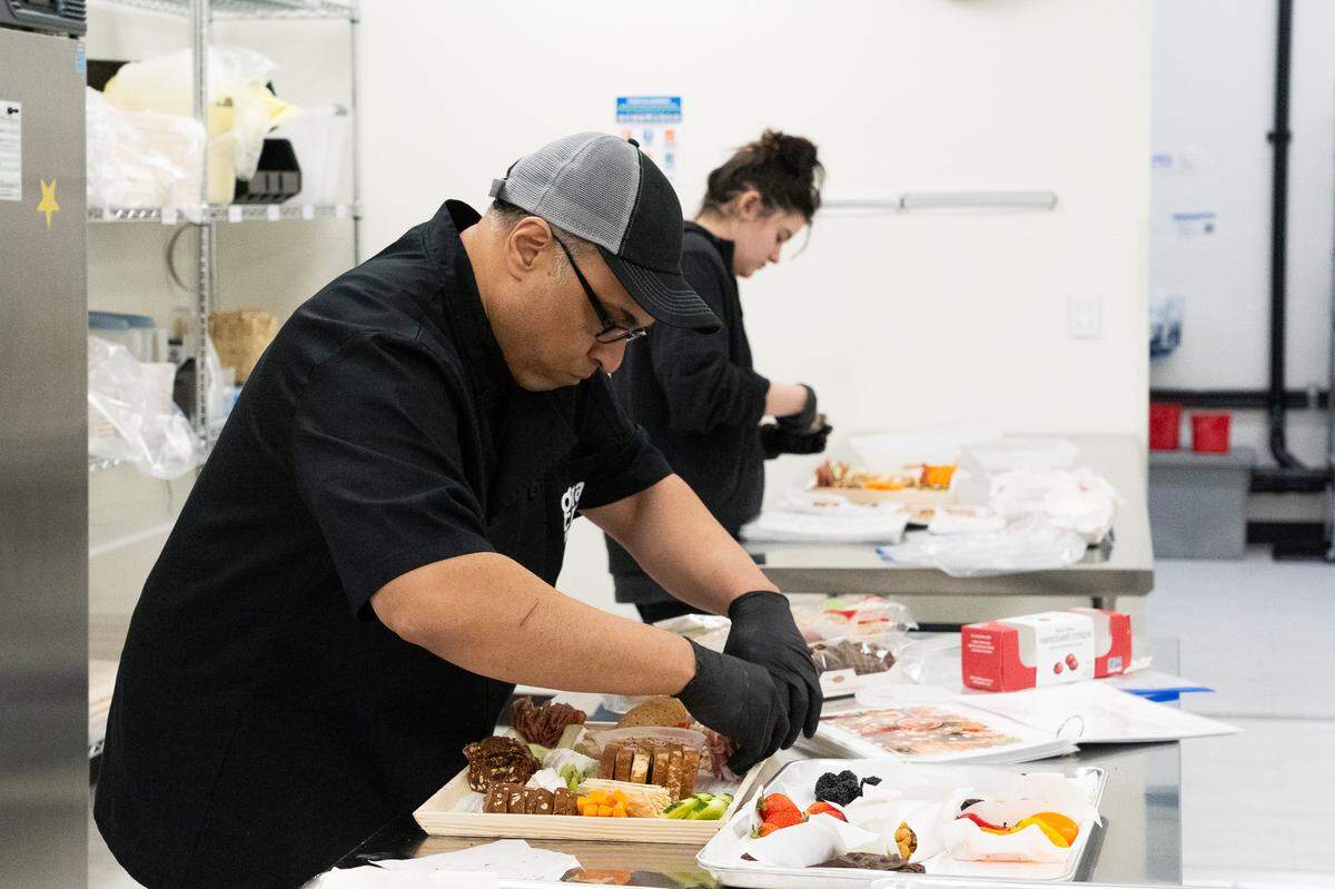 Owner Adrian Garib and worker Cailin Cunningham assemble grazing boards. Photographed on Dec. 18, 2025.