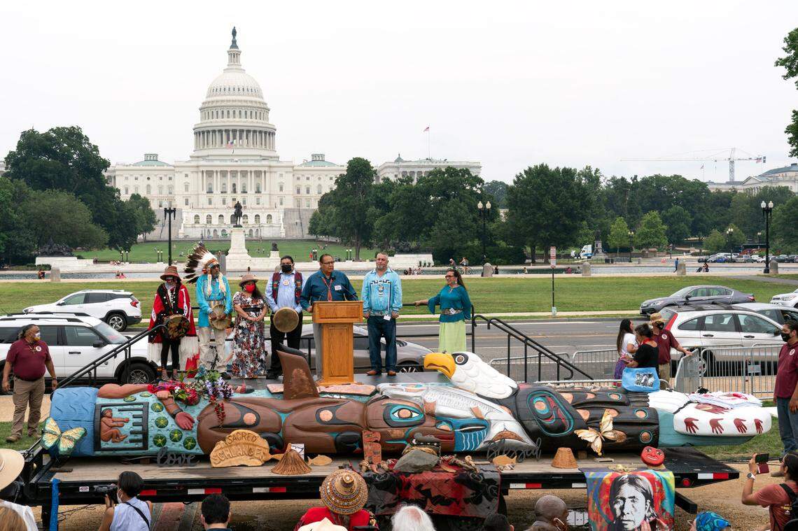 Native American leaders speak during a totem pole delivery ceremony by tribal leaders and Indigenous activists, on Capitol Hill in Washington, D.C., Thursday, July 29.