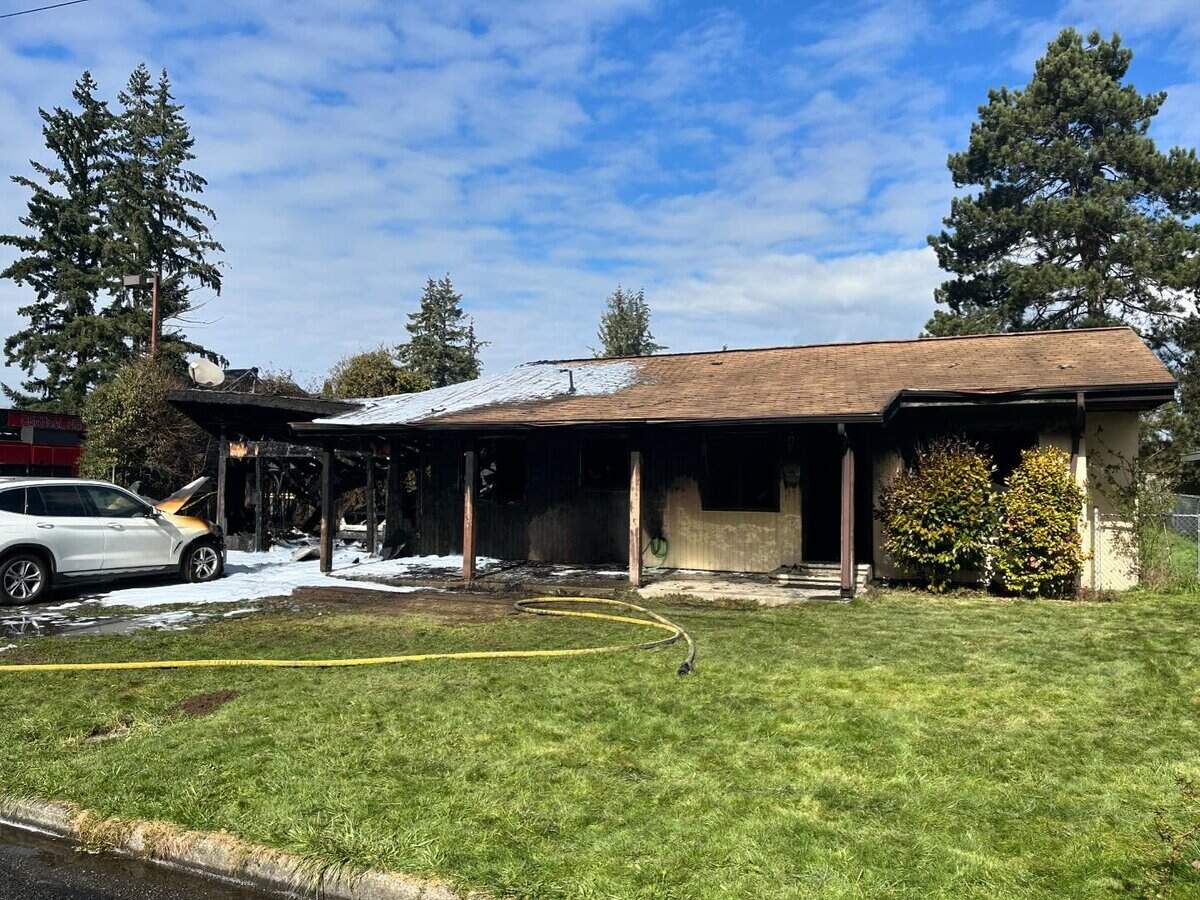 Roads are closed following a house fire in the 400 block of 10th Avenue Southeast.