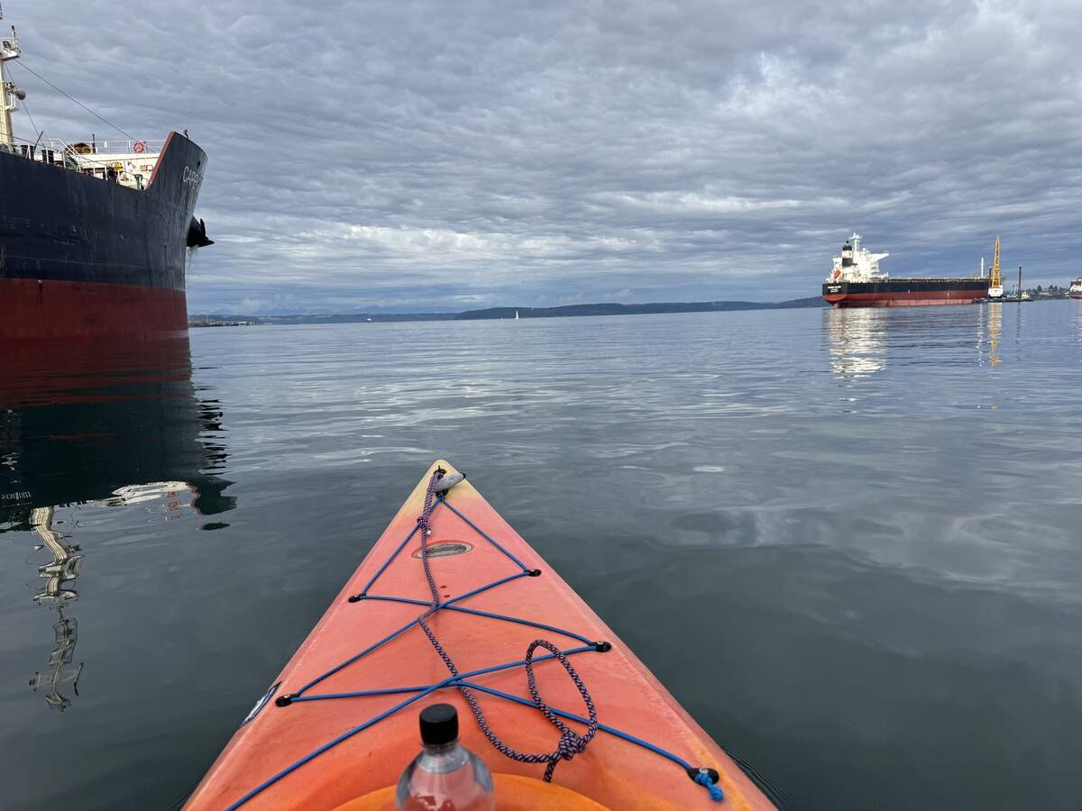 Outdoors reporter Gavin Feek paddles his kayak from the Foss Waterway into Commencement Bay on a warm winter day in 2026.