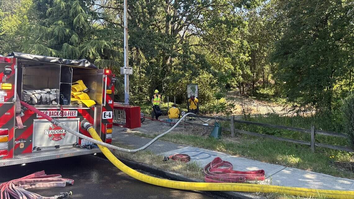 Temporary road closures in place as firefighters battle Wapato Park brush fires