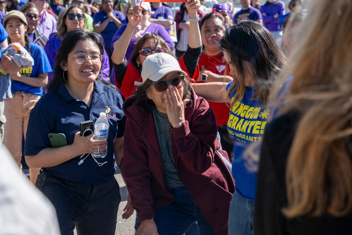 Lewelyn Dixon, center, reacts to being greeted by a crowd of supporters after being released from the Northwest ICE Processing Center on Thursday, May 29, 2025, where Dixon has been detained for months in Tacoma, Wash.