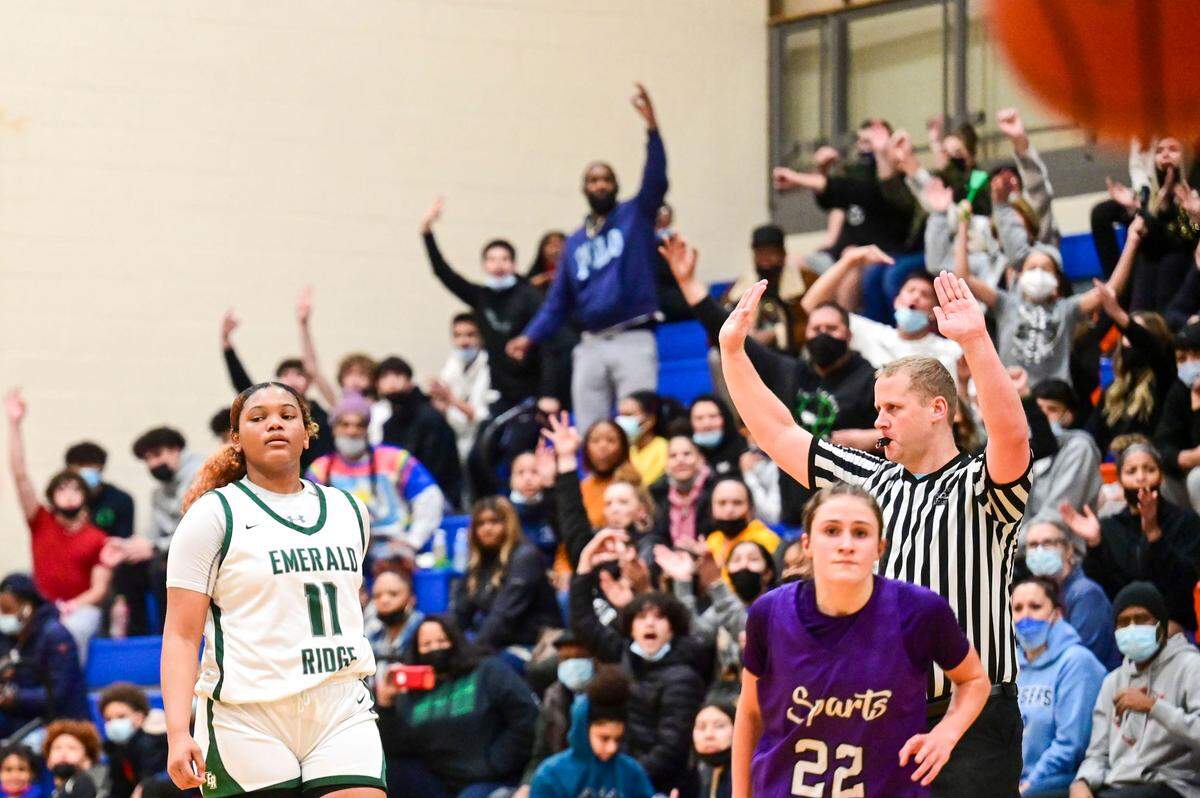 Emerald Ridge supporters celebrate after guard Marecia Barnett (11) scored a 3-pointer in the first quarter of a 4A South Puget Sound League tournament championship game against Sumner on Saturday, Feb. 5, 2022, at Graham-Kapowsin High School in Graham, Wash.