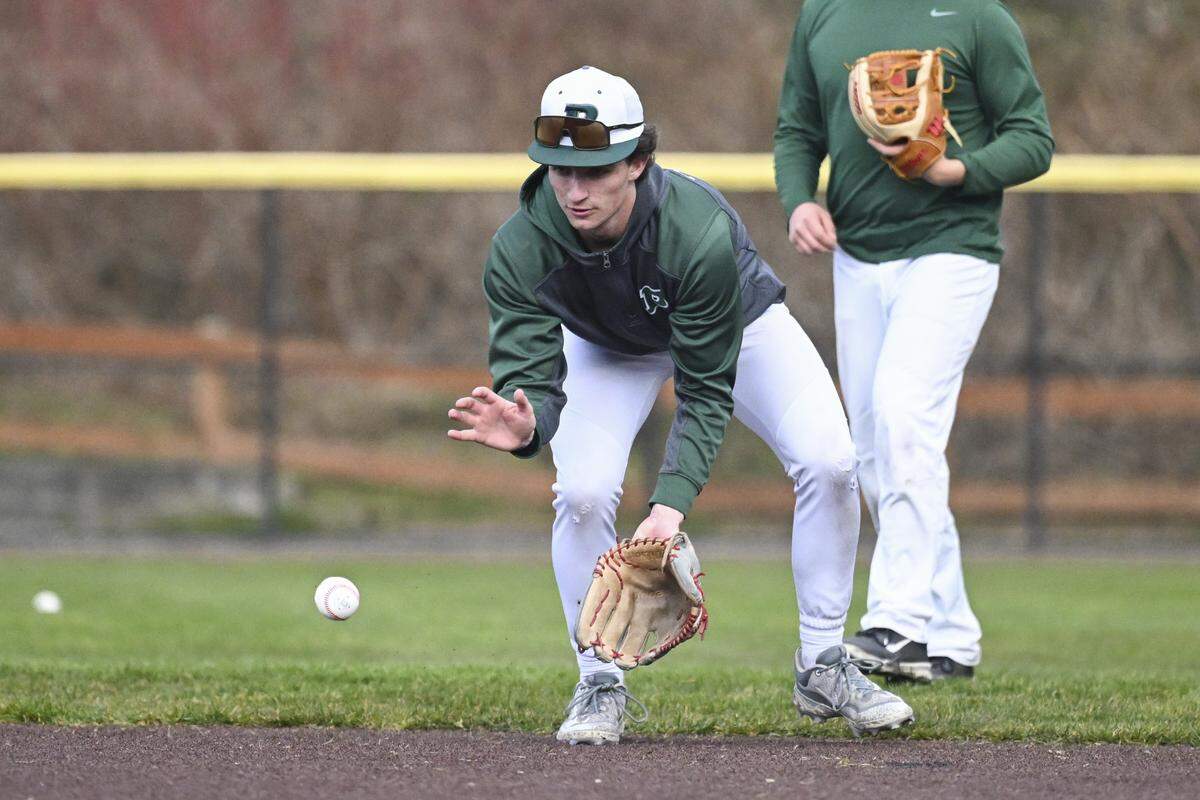 Peninsula pitcher and shortstop Kaleb Copeland runs a grounder drill on Monday, March 9, 2026, at a practice in Gig Harbor, Wash.