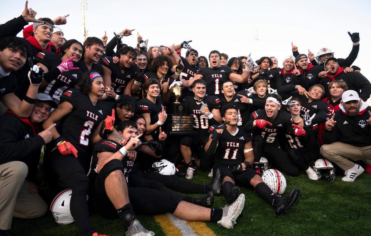 The Yelm Tornados celebrate their 20-13 state championship victory over the Eastside Catholic Crusaders in the 3A football state championship game at Sparks Stadium in Puyallup, Washington, on Saturday, Dec. 3, 2022.